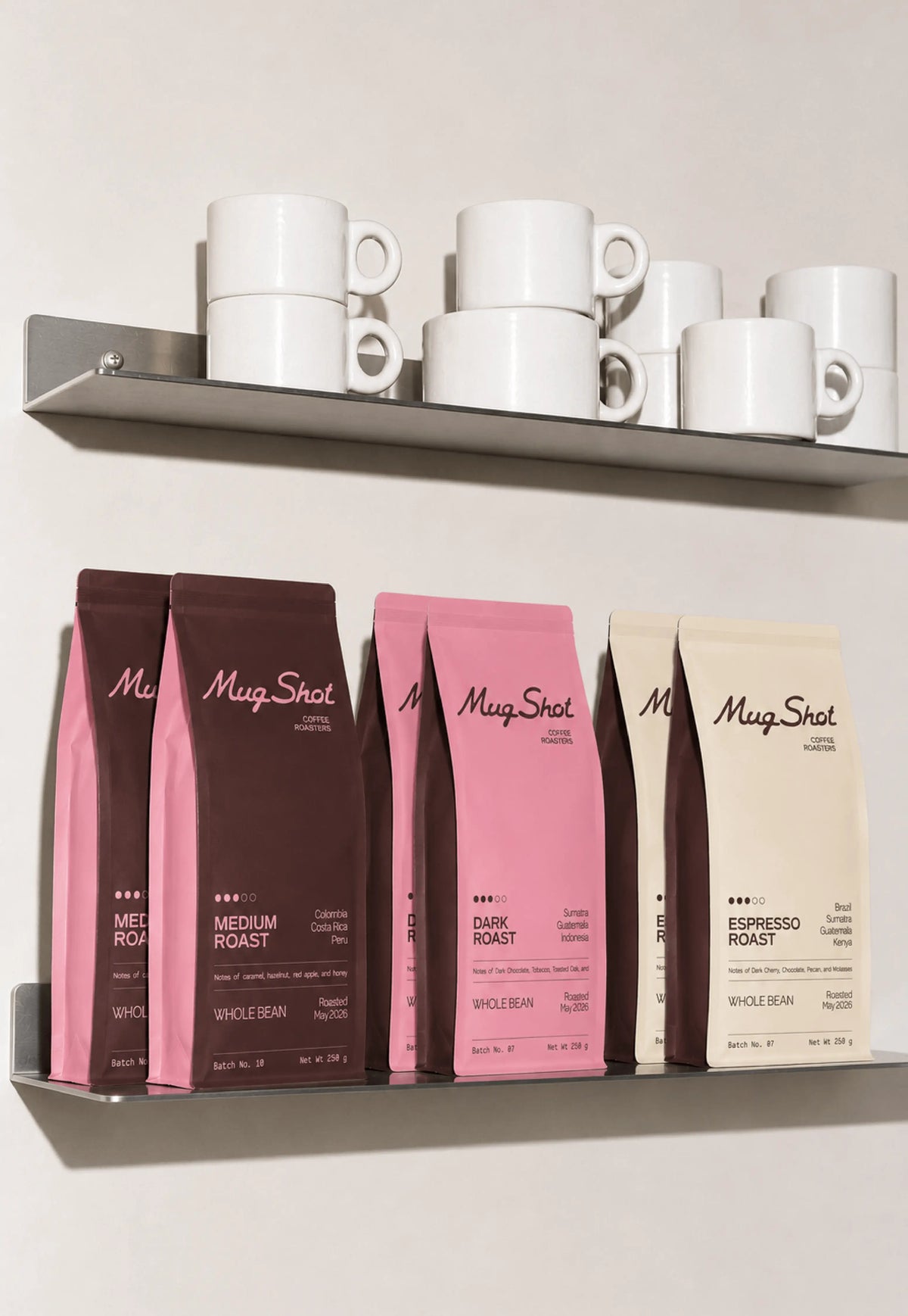 Mug Shot coffee bag packaging system, color-coded burgundy, pink and cream designs for medium, dark and espresso roasts