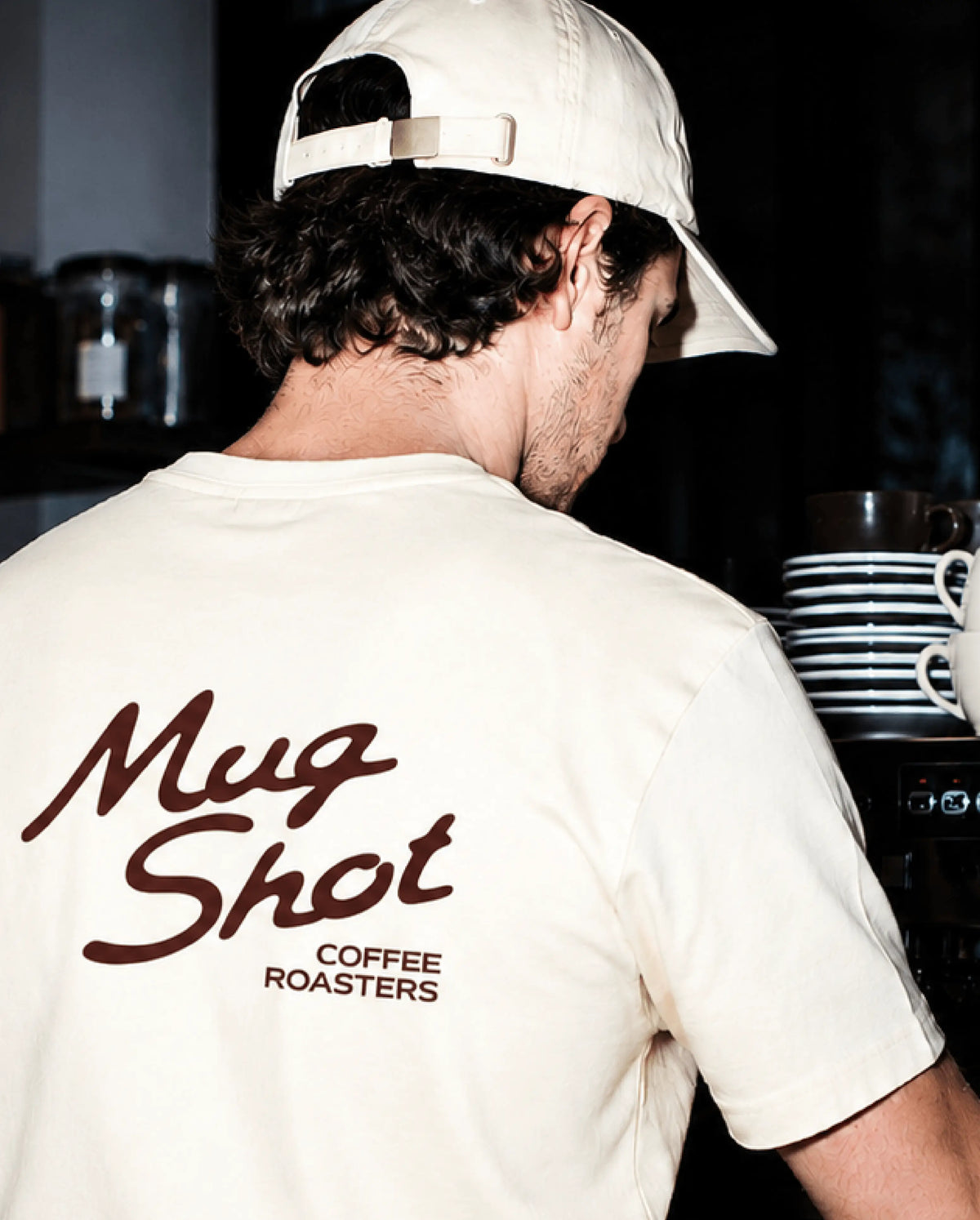 Mug Shot apparel design: cream t-shirt with large back print of the script wordmark logo