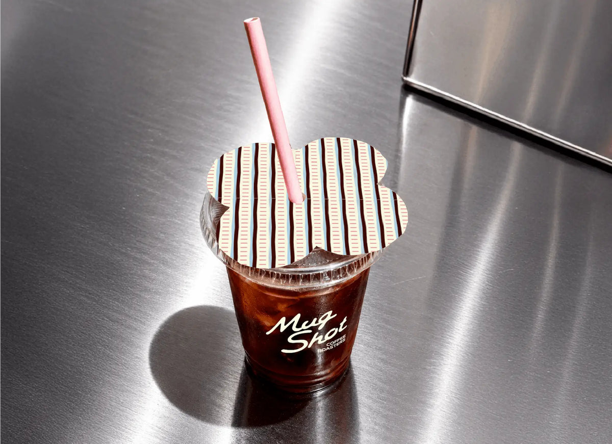 Mug Shot iced coffee cup branding with custom striped lid topper design and script logo print