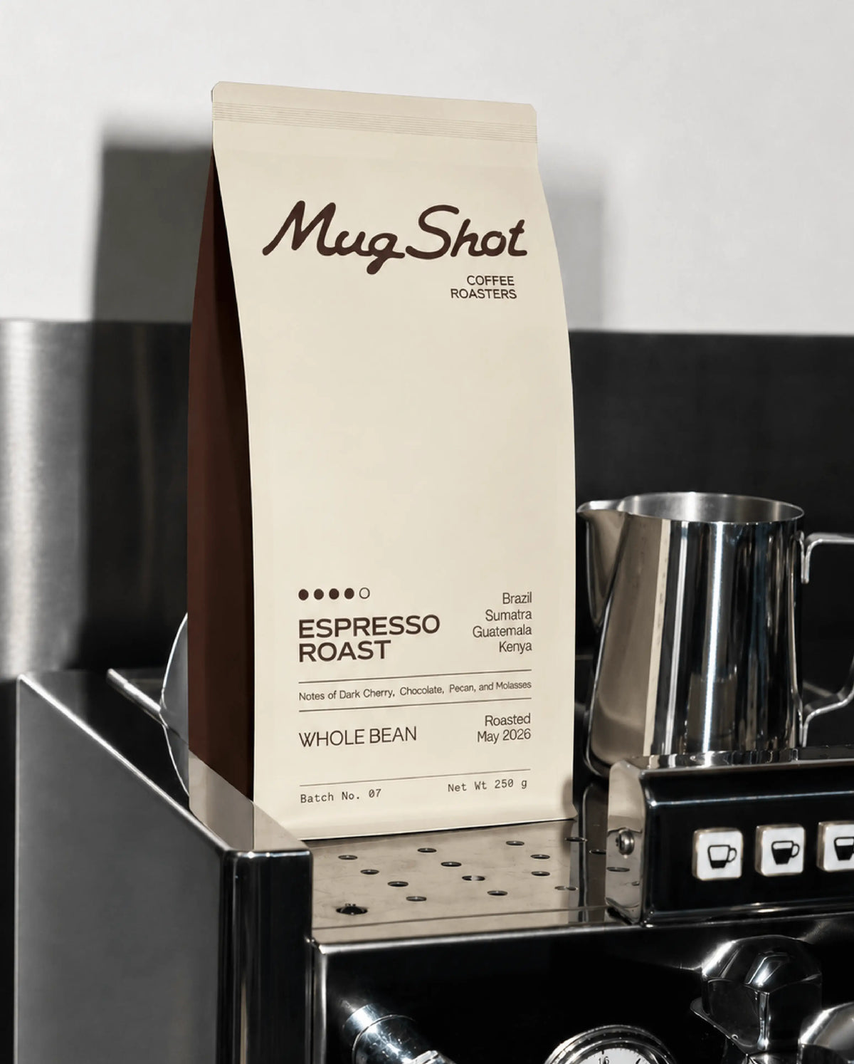 Mug Shot espresso roast packaging design: cream coffee bag with script logo and minimal typographic label