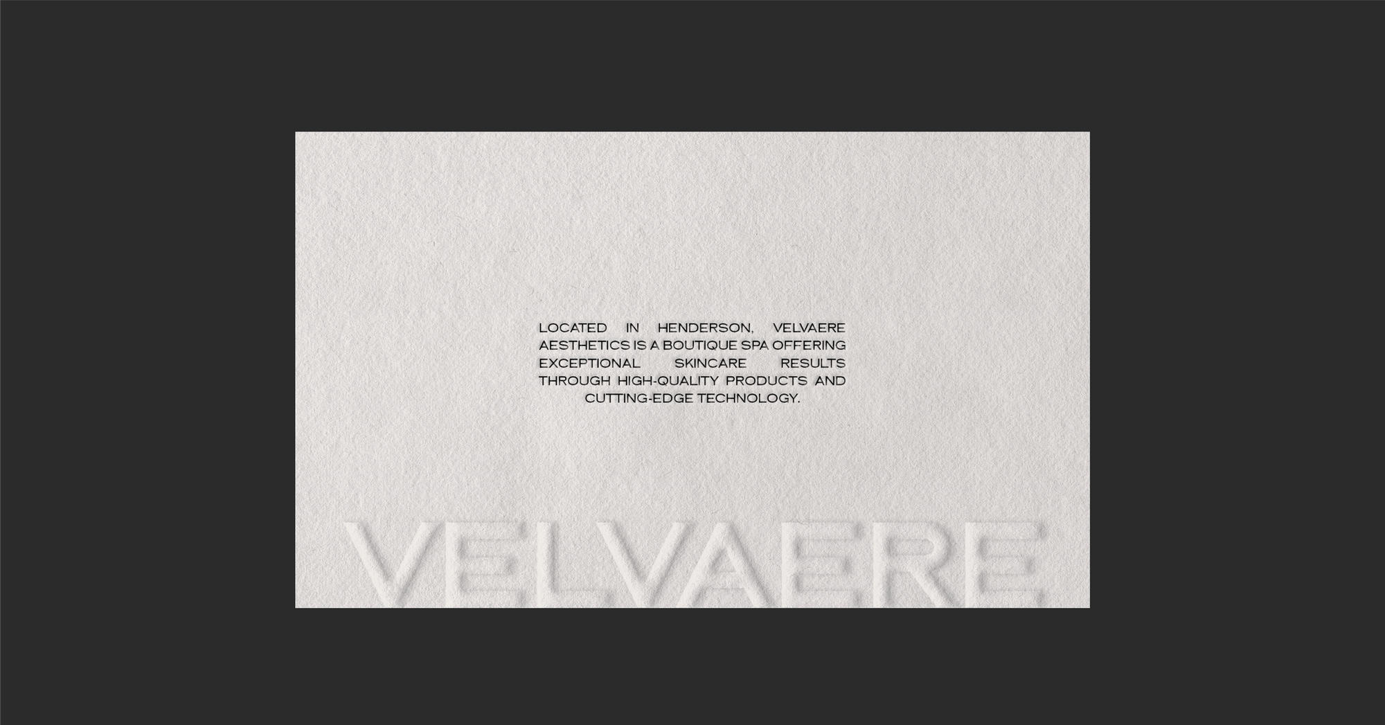White card with embossed "Velvaere" and black text