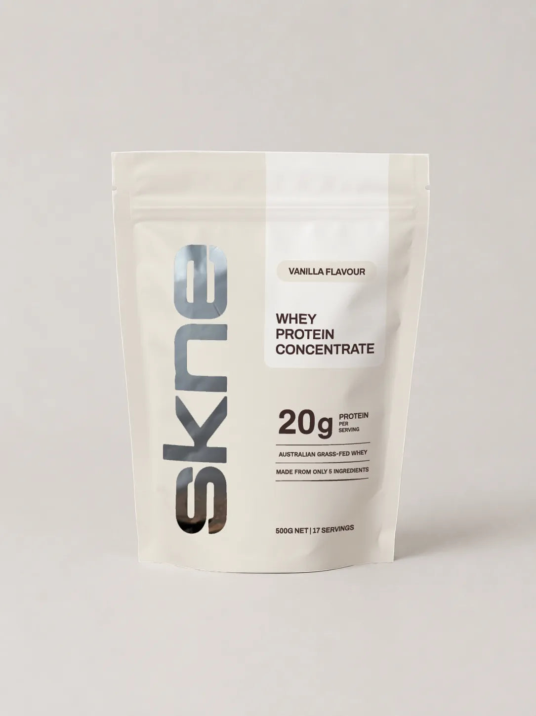 SKNE whey protein pouch packaging design, front, with vertical foil wordmark and vanilla flavour label